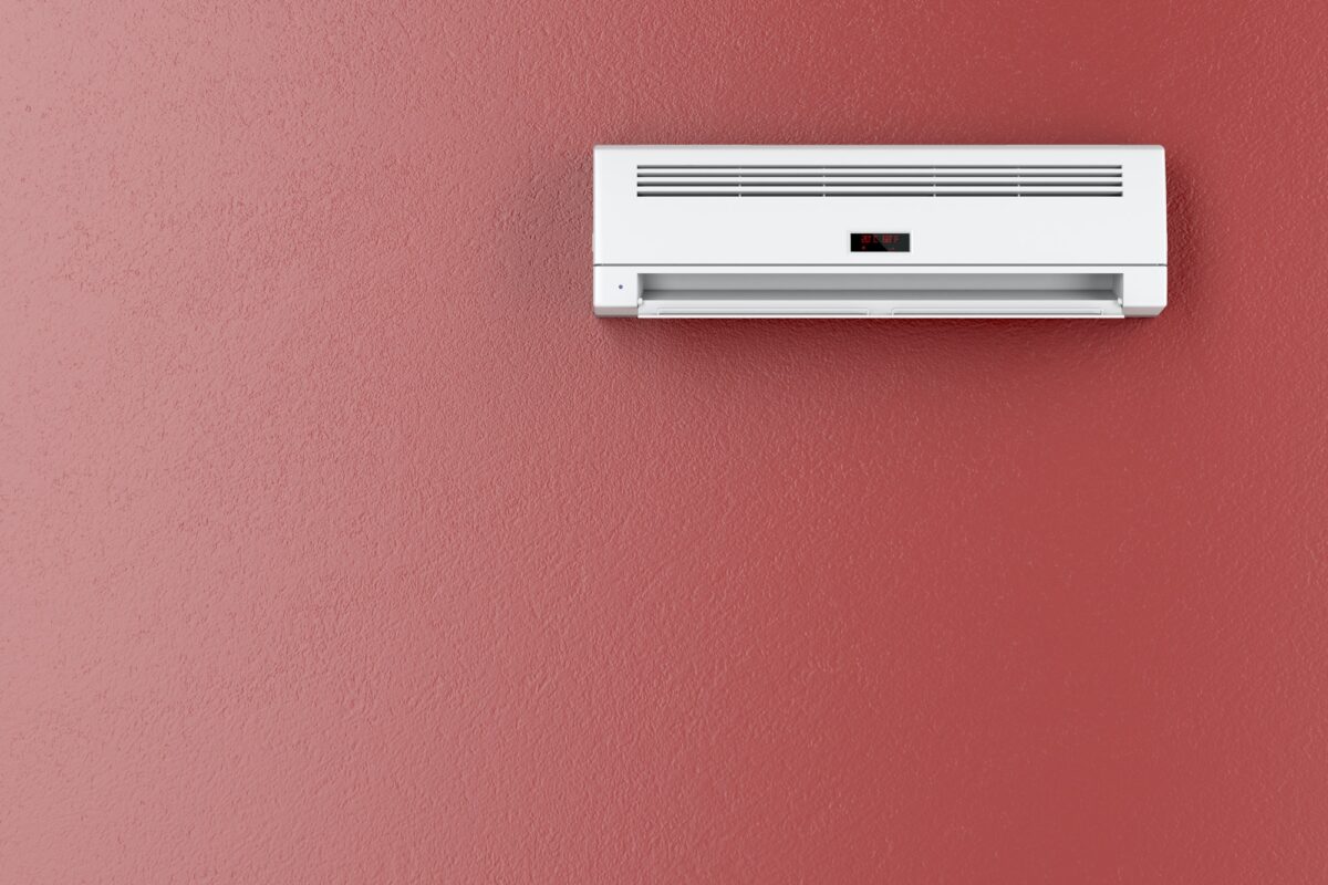 Air conditioner on red wall
