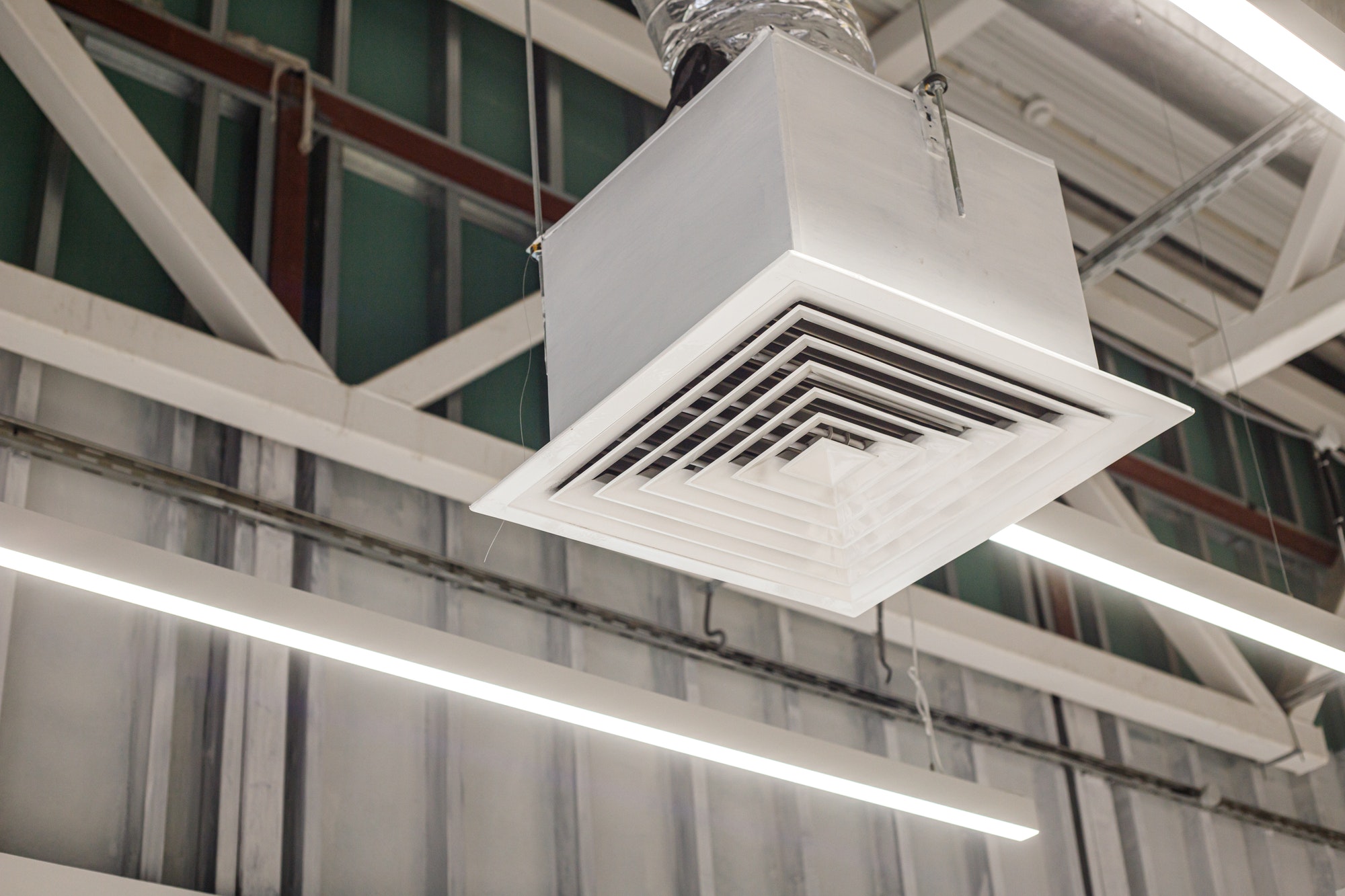 Square grid with supply ventilation duct in commercial building. Industrial ventilation system